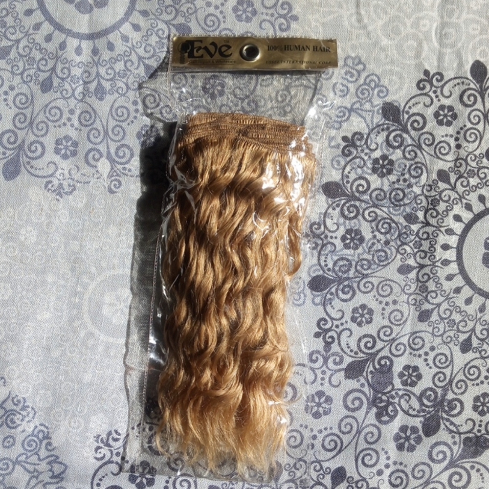 10 inch long human hair weft, curly golden blonde.
